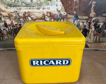 A large square yellow traditional retro Ricard plastic lidded ice bucket