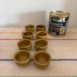A traditional set of  8 French vintage oven proof individual stoneware snail dishes