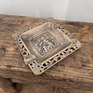 A vintage Dutch Repousse small square 2.75" silver plated ash tray