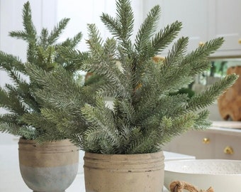 Small fake Christmas Pine tree in a neutral stone pot. Perfect for table top or windowsill. 23cmL x 25cmW x 48cmH