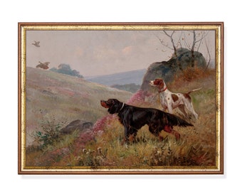 May include: A framed oil painting depicting two hunting dogs in a field. The dogs are pointing towards the sky, with a bird flying overhead. The painting is set in a rural landscape with rolling hills and trees in the background.