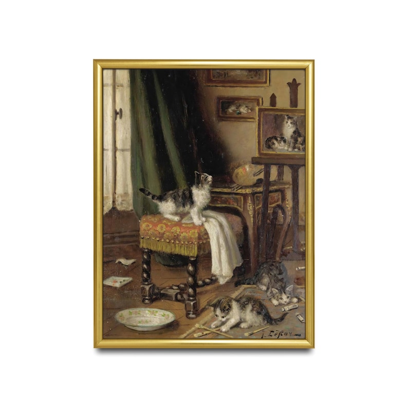 May include: A framed painting showing a domestic scene with kittens. One kitten stands on a patterned stool, while others play on the floor. The artwork has a gold frame and a detailed interior setting with furniture and decor.