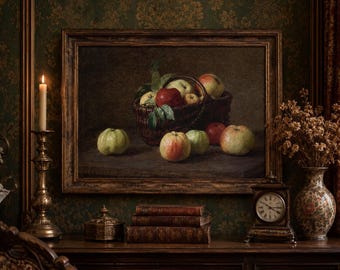 May include: A framed oil painting depicting a still life of various apples in a woven basket and on a dark surface. The artwork features red and green apples with green leaves, set against a dark, muted background, enclosed in a dark wood frame.