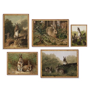 May include: A set of five framed prints featuring various images of rabbits in different settings. The prints are all in a similar style, with a brown wooden frame and a white mat.