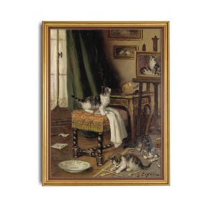 May include: An oil painting in a gold frame showing a domestic interior with kittens. One kitten stands on a patterned stool, others play on the floor. The scene includes a window, furniture, and a bowl, creating a detailed, classic artwork.
