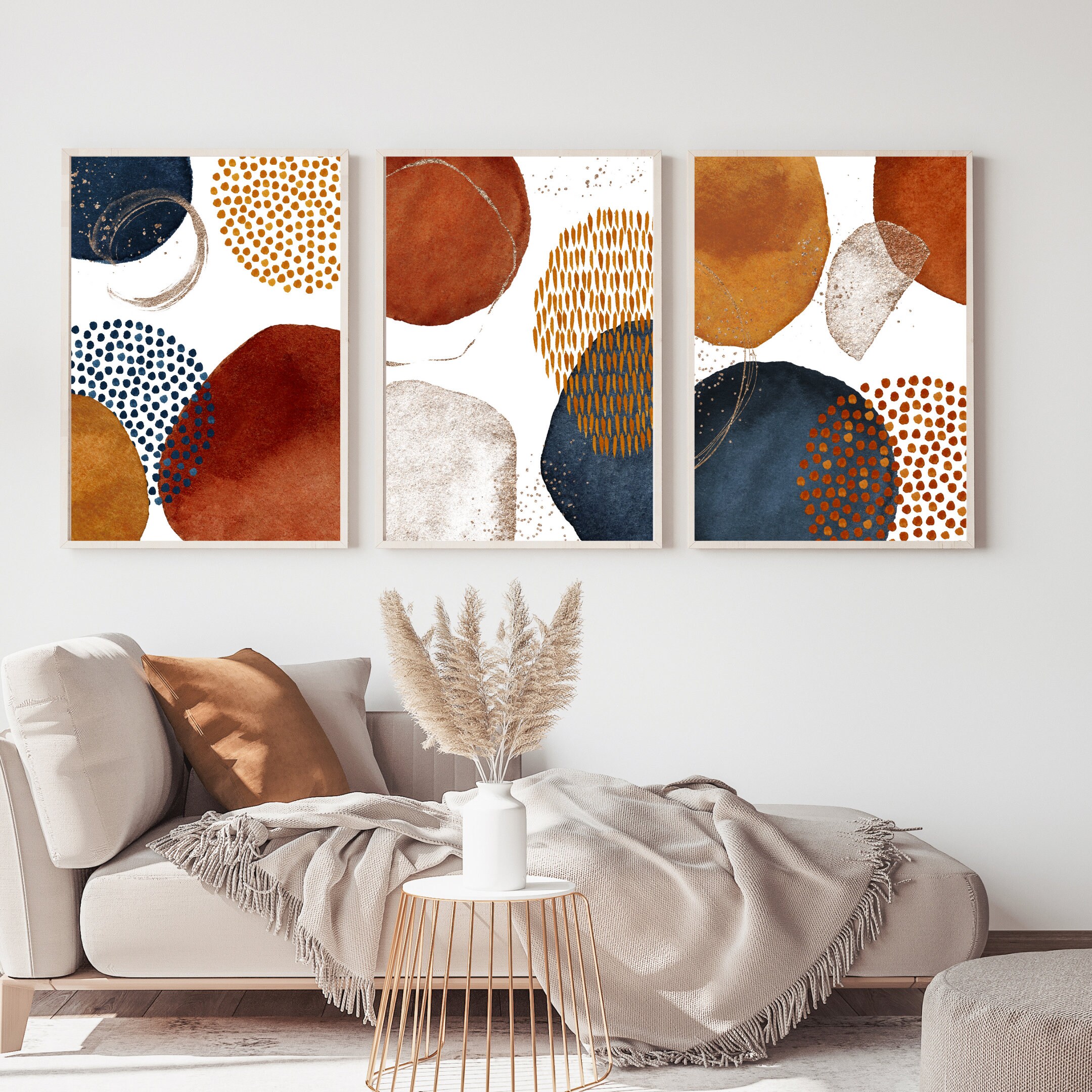 Gold cherub on wall above a vibrant, multi colored sofa in a bright blue  nineties cottage living room with orange painted beams Stock Photo - Alamy, image size:2160x2160