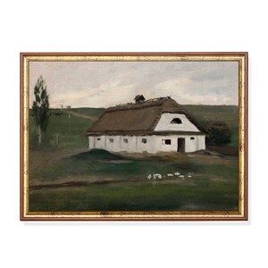 May include: A framed painting of a rural landscape featuring a white building with a thatched roof. The artwork depicts a grassy field, a tree, and a cloudy sky. The frame is a warm, golden brown color.