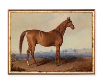 May include: A framed painting of a chestnut horse standing in a field. The horse is depicted in profile, with a long, flowing tail and a slender build. The background features a landscape with trees, buildings, and a cloudy sky. The frame is brown with a gold inner border.
