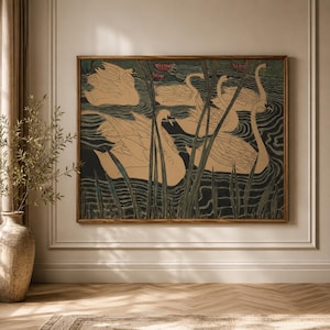 May include: A rectangular wall art print in a wooden frame featuring a stylized illustration of five beige swans swimming in dark water among tall green reeds and small pink water lilies. The artwork uses a muted color palette with dark lines.