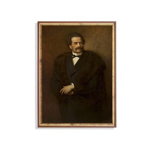 May include: A framed portrait of a man in a dark suit and fur-lined coat. The man has a mustache and a bow tie. The background is a shade of brown.
