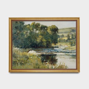 May include: A framed painting depicting a lush green landscape with a winding river flowing through it. The river is surrounded by trees and foliage, and the sky is a soft blue.