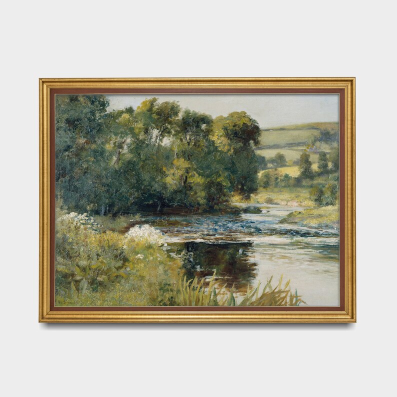 May include: A framed painting depicting a lush green landscape with a winding river flowing through it. The river is surrounded by trees and foliage, and the sky is a soft blue.