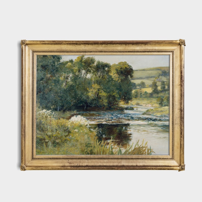May include: A framed painting depicting a landscape scene with a river winding through a lush green forest. The river is calm and reflective, with a light blue hue. The forest is dense and verdant, with trees of various sizes and shapes. The painting is set against a backdrop of rolling hills and a clear blue sky.