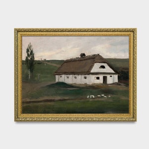 May include: An oil painting of a white building with a thatched roof, set in a green field under a cloudy sky. The artwork is framed in a gold ornate frame, adding a classic touch to the rural landscape scene.