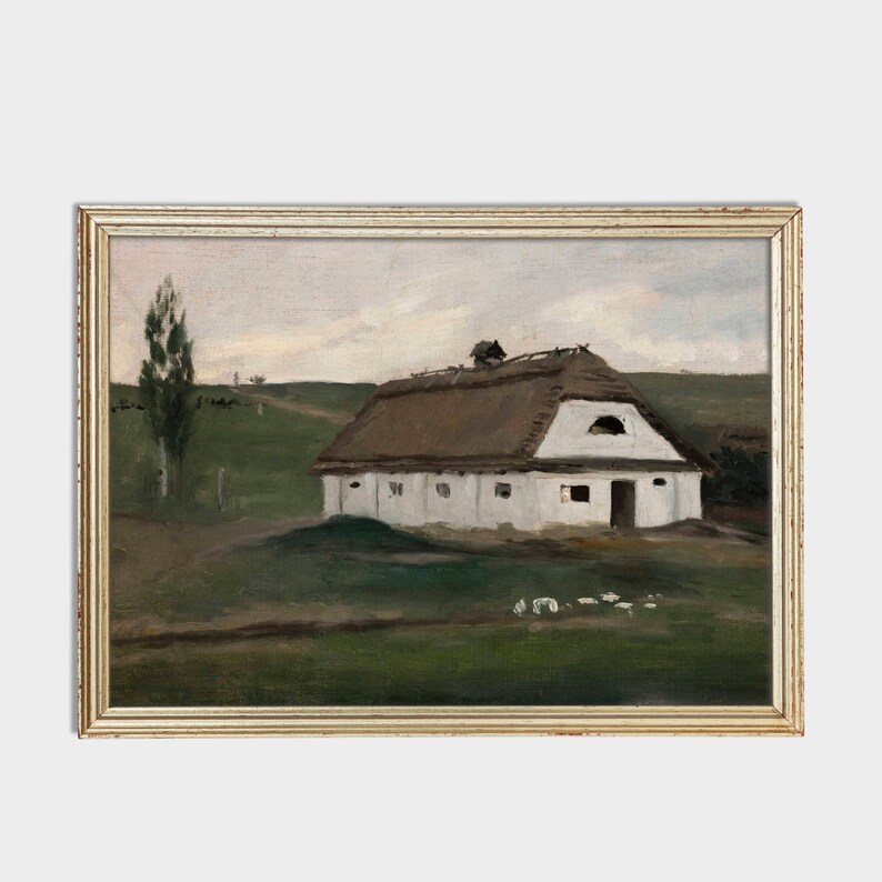 May include: An antique framed painting depicts a white farmhouse with a thatched roof set in a green field. A tall tree stands to the left, and a dirt path leads into the distance under a cloudy sky. The painting is in a gold-colored frame.