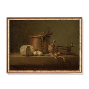 May include: A still life painting of a copper pot, a round loaf of bread, three eggs, a mortar and pestle, a bowl, and a bunch of green onions on a wooden table. The painting is framed in a brown wooden frame with a gold trim.