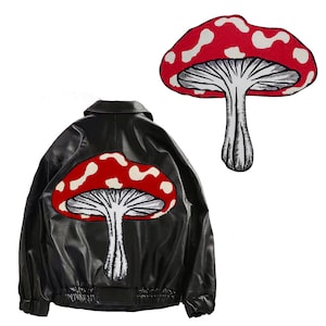 May include: A black leather jacket with a red and white mushroom patch on the back.