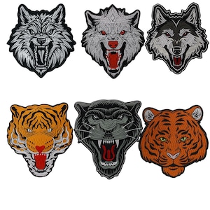 May include: Six embroidered iron-on patches featuring animal faces. The patches include a wolf, a tiger, a panther, and two different styles of a wolf. The patches are all in a realistic style and have a variety of colors.