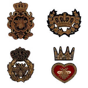 May include: Four embroidered iron-on patches with gold thread and black velvet. The patches feature a crown, a bee, and a heart.