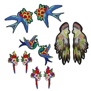 May include: A set of ten embroidered iron-on patches featuring colorful birds and flowers. The patches are perfect for adding a touch of whimsy to clothing, bags, or other fabric items.