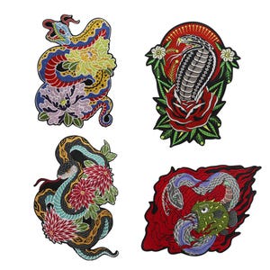 May include: Four embroidered patches featuring snake designs. One patch shows a colorful snake coiled around flowers. Another depicts a cobra with a rose. The third shows a snake with flowers, and the last shows two snakes and a fish.