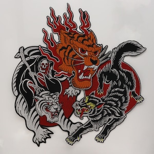 May include: An embroidered patch featuring a central orange tiger head surrounded by red flames, a grim reaper figure riding a white tiger on the left, and a black wolf on the right, all set against a circular red background with detailed stitching.