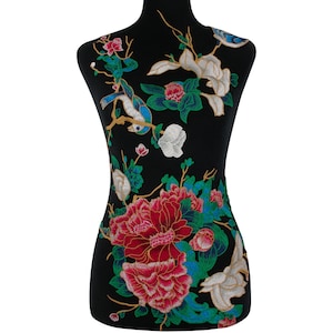 May include: Embroidered floral applique featuring a large red and pink peony flower, white magnolia blossoms, blue and green leaves, and a gold and blue bird.