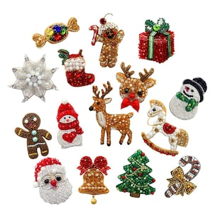 May include: A selection of beaded Christmas decorations. The collection includes a snowflake, a sweet, a gingerbread man, a snowman, a reindeer, a Christmas tree, a bell, a rocking horse, a Santa Claus, a gift box, a stocking, and a candy cane.
