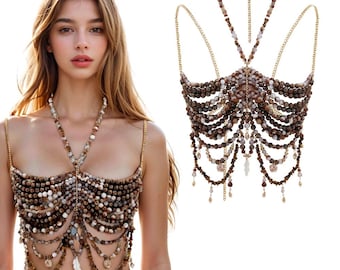 May include: A beaded body chain top featuring multiple strands of brown, white, and tan marbled beads arranged in a layered, scalloped pattern. The design includes thin gold-toned metal chains, a halter-style neck strap, and dangling bead accents.