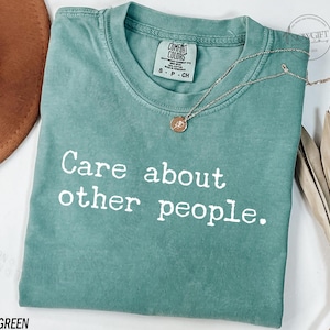 Puede incluir: Camiseta verde claro con el texto "Care about other people." impreso en blanco.