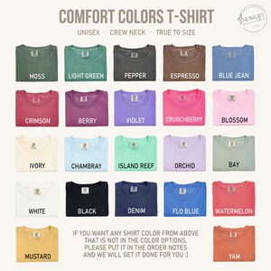 May include: A grid of Comfort Colors T-shirts in various colors, including moss, light green, pepper, espresso, and blue jean. The image includes the text "COMFORT COLORS T-SHIRT" and "UNISEX CREW NECK TRUE TO SIZE."