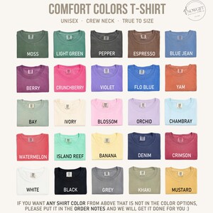 May include: A chart of 25 different colors of t-shirts, with the color name printed below each shirt. The text at the top reads "COMFORT COLORS T-SHIRT" and "UNISEX CREW NECK TRUE TO SIZE".