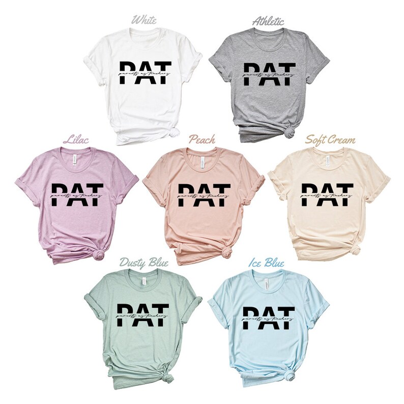May include: A set of ten t-shirts in various colours, each featuring the text "PAT" in black block letters with the words "pretty as today" in smaller script below. The t-shirts are displayed against a white background.