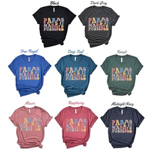 May include: A set of ten t-shirts in various colors featuring the text "PARAS MAKE IT POSSIBLE" in a rainbow-colored, retro font.