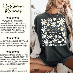 May include: Dark gray t-shirt with a daisy design and the text "Helping You Grow to Your Full Potential Occupational Therapy." The shirt also has customer reviews.