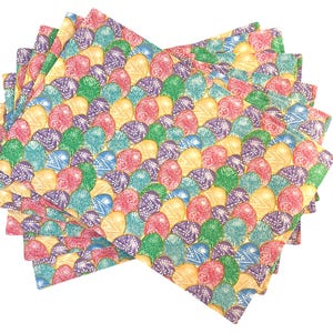 May include: A stack of eight colorful Easter-themed napkins with a pattern of pastel-colored eggs with intricate designs. The napkins are made of paper and are perfect for adding a festive touch to your Easter table.