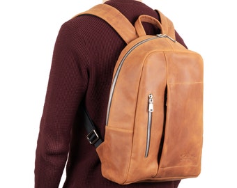 Mochila urbana de piel auténtica: bolsillo acolchado para portátil y tableta