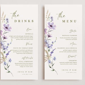 Puede incluir: Dos elegantes tarjetas de menú con diseños florales en acuarela. La tarjeta de la izquierda dice "The Drinks" y enumera cerveza, vinos y refrescos. La tarjeta de la derecha dice "The Menu" y enumera entrantes, platos principales y postres.