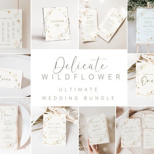 May include: A wedding stationery suite with a delicate wildflower theme. The suite includes save the dates, invitations, table numbers, menus, and more. The design features a wreath of wildflowers with gold accents.
