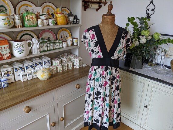 90s tea dress 90s Vintage Silk Tea Dress, Cream and Black With Retro Art Deco Pattern  With Pink and Green. Cap Sleeves, V Neck. Black Silk Tie-back Sash