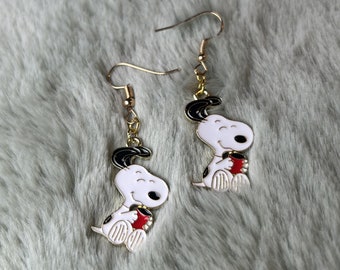 snoopy sitting holding a red cup of coffee gold charm earrings