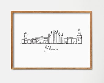 Könnte beinhalten: Eine Schwarzweiß-Linienzeichnung der Skyline von Mailand, einschließlich des Doms, mit dem Wort "Mailand" darunter. Die Zeichnung ist in einem hellen Holzrahmen gerahmt und hängt an einer weißen Wand.