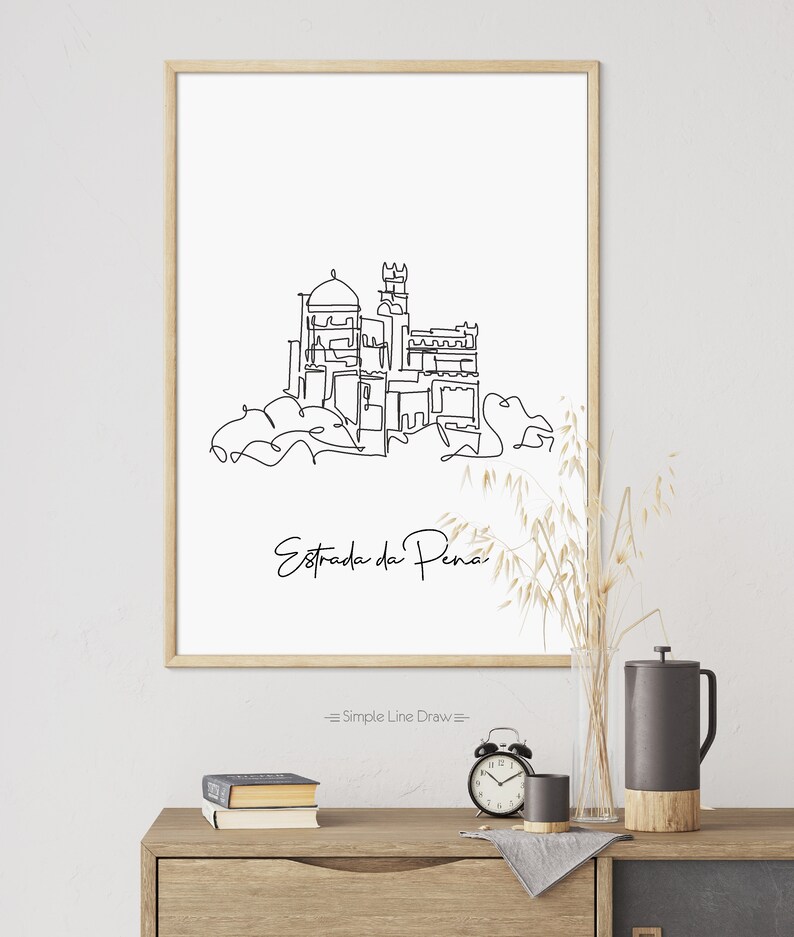 May include: A black and white line drawing of the Pena Palace in Sintra, Portugal. The drawing is on a white background with the text "Estrada da Pena" and "Simple Line Draw" below the drawing.