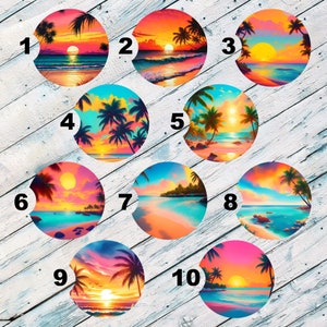 May include: Ten colorful round coasters with a tropical sunset beach scene. Each coaster features a different sunset color scheme with palm trees and a beach.