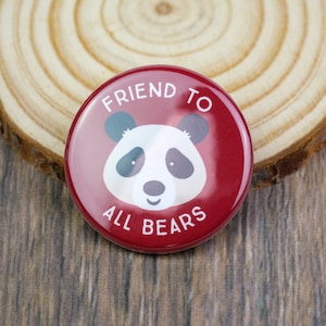 May include: Red button with a white panda bear and the text "Friend to All Bears".