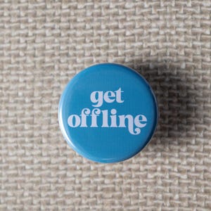 May include: A round, light blue button with the words "get offline" in white, stylized font. The button is set against a textured, beige background.