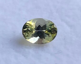 1.20cts,Natural faceted greenish yellow unheated tanzanite oval cut.