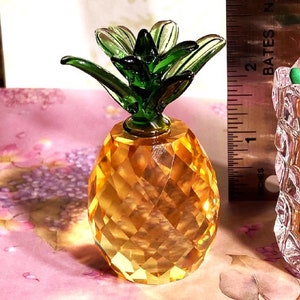 Crystal pineapple * sparkly canary yellowy-gold solid base with emerald green topper. Let light shine through it = Beautiful ! 1.5 " x 2.75"