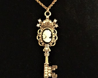 Lovely cameo skeleton key pendant / keychain / décor; Black & white with goldtone and crystals ...somewhat Steampunk vibes, Victorian, Goth