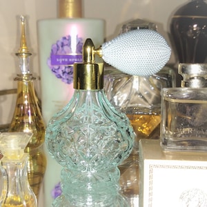 Sky blue perfume atomizer w/ golden trim * Never been used; Totally clean - &quot;puffer&quot; (atomizer) works great! 3.5 inches tall; 3 oz. capacity